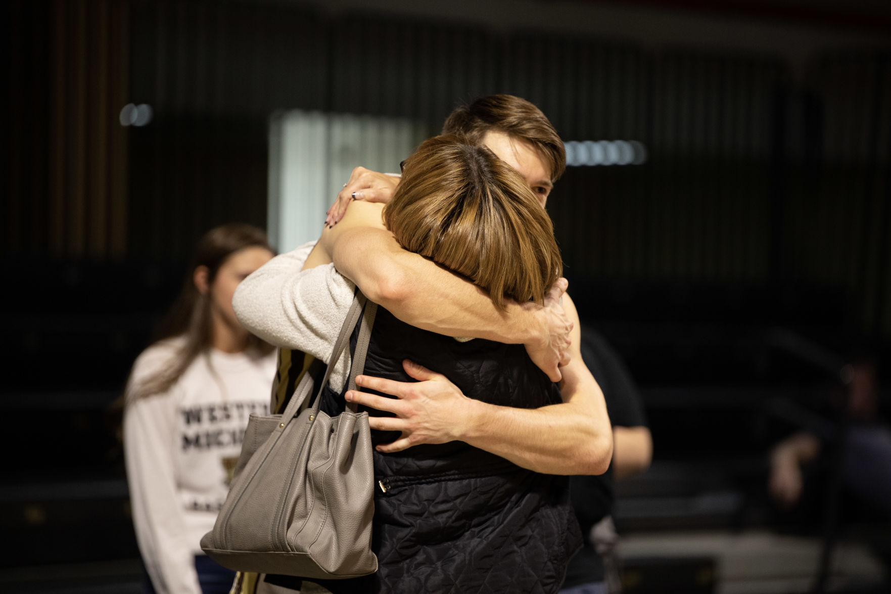 Jason Whitens embraces his mom after his career day.